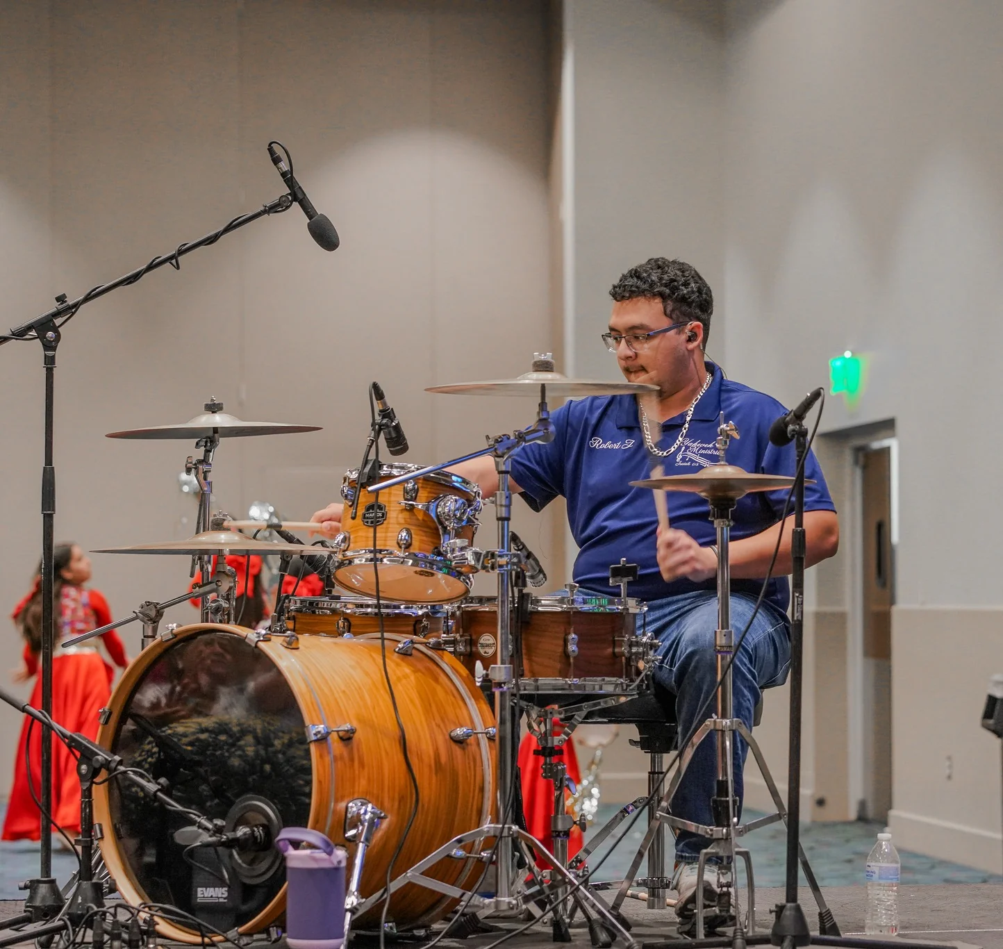 Drum kit miked up in a live production environment